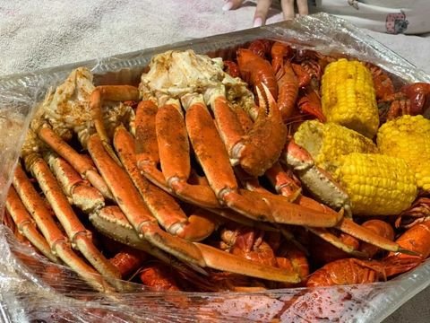 Fried fish and shrimp served with sides.